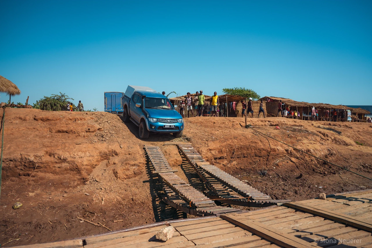 Mitsubishi L200 pickup crossing a bridge off-road in Madagascar