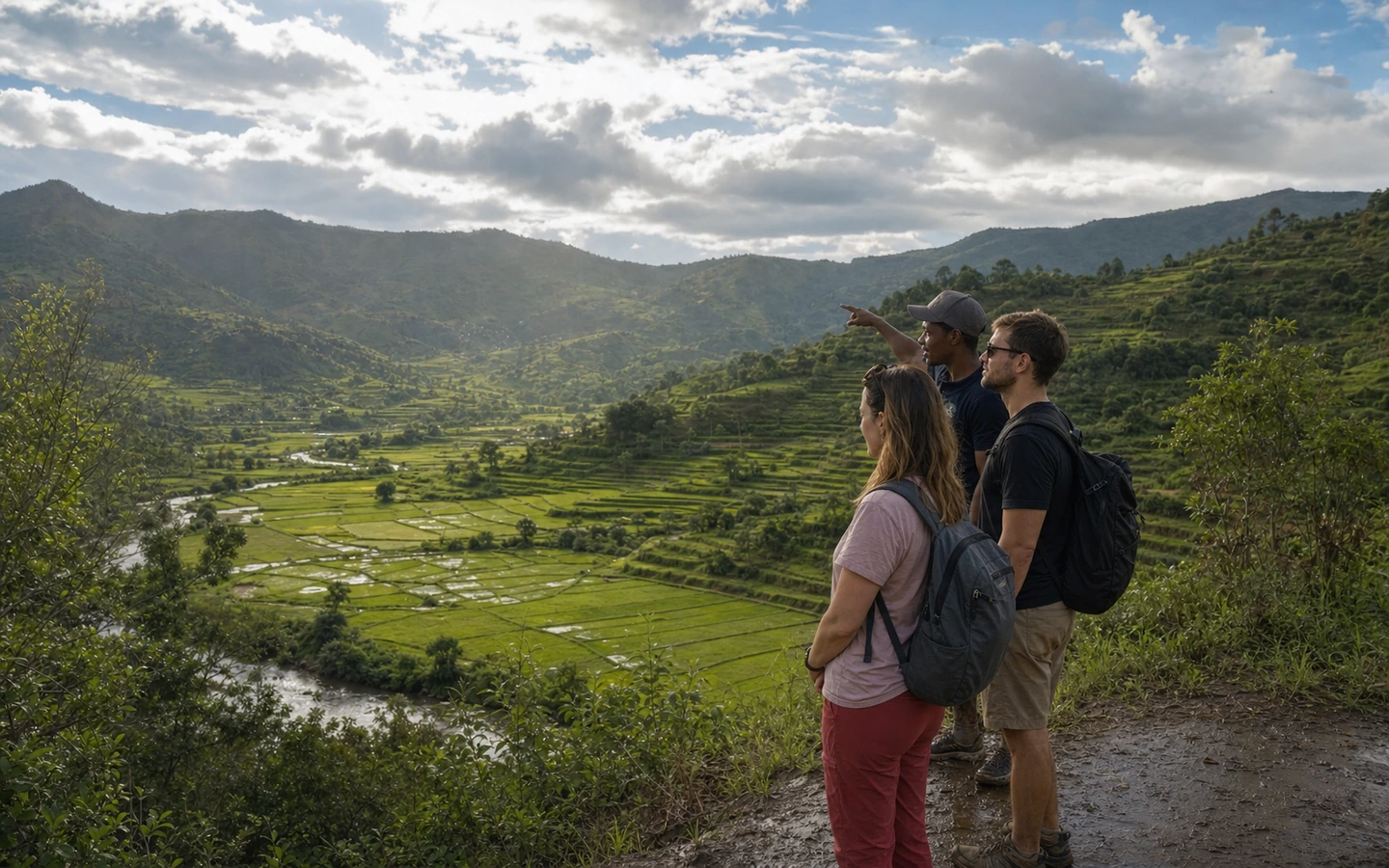Travellers with their driver-guide above green rice terraces in Madagascar’s highlands