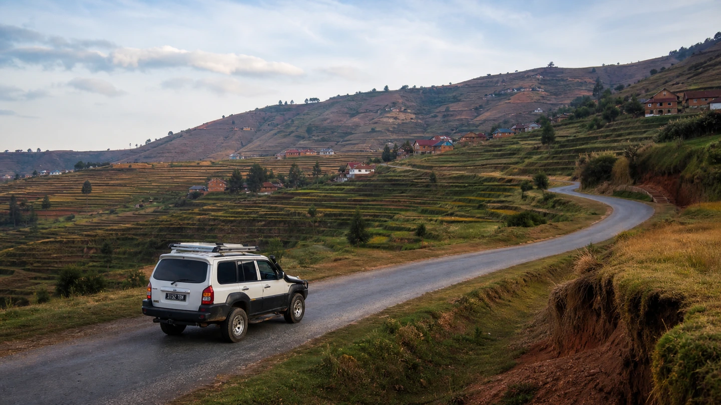White Mada Car Drive Hyundai Terracan on the RN7 between highland rice fields